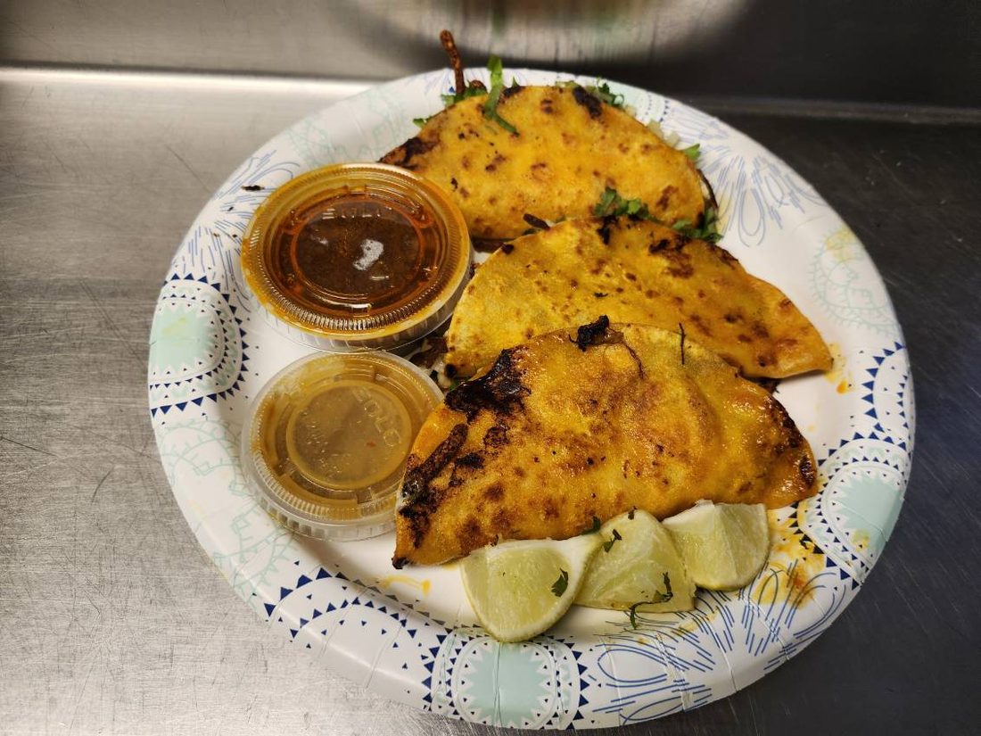 Quesabirria quesadilla with consomé.